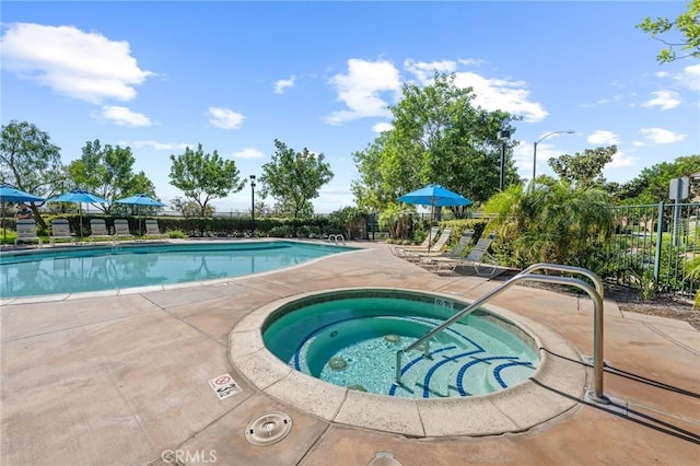 view of swimming pool featuring a community hot tub