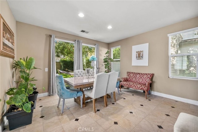 dining area featuring light tile patterned floors