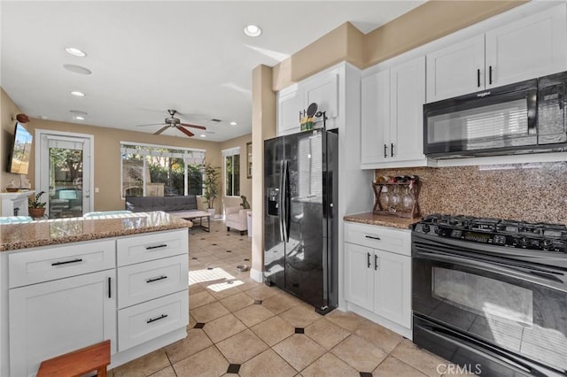 kitchen with white cabinets, black appliances, tasteful backsplash, ceiling fan, and light stone counters