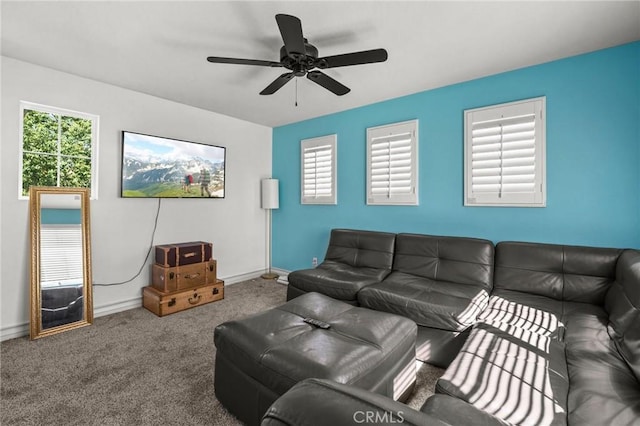 living room featuring ceiling fan and carpet floors