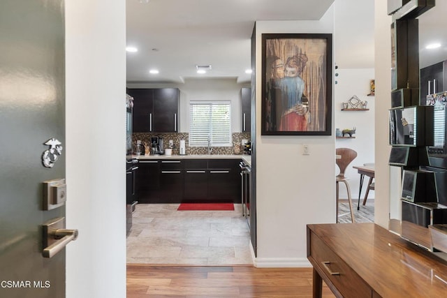 interior space with sink and light hardwood / wood-style flooring