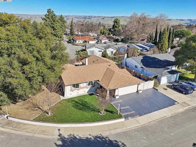 birds eye view of property with a mountain view