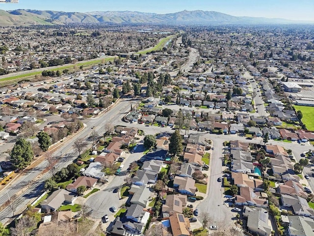 birds eye view of property featuring a mountain view