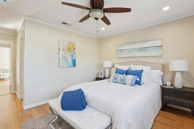 bedroom featuring crown molding, ceiling fan, and wood-type flooring