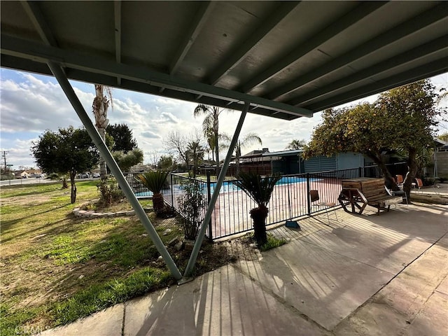 view of patio with a fenced in pool