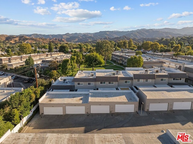 birds eye view of property featuring a mountain view