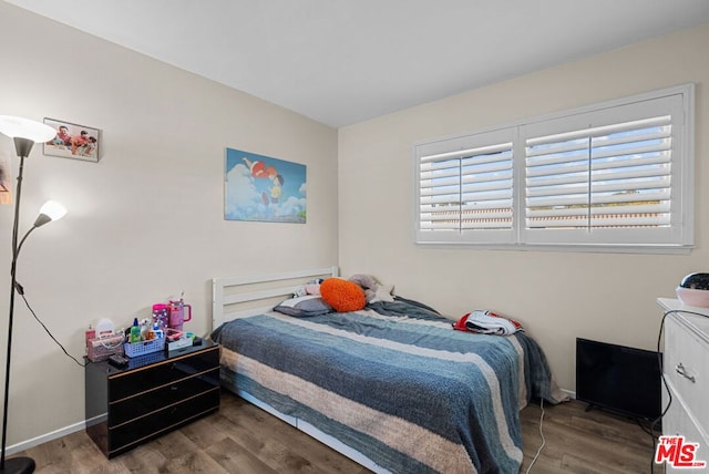 bedroom featuring hardwood / wood-style flooring