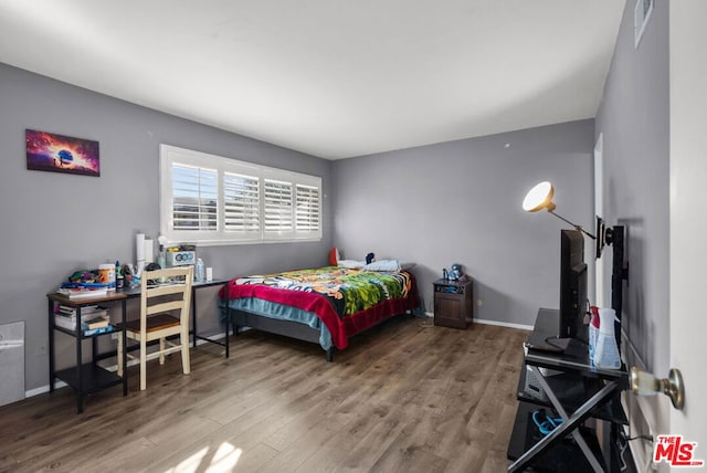 bedroom featuring hardwood / wood-style floors