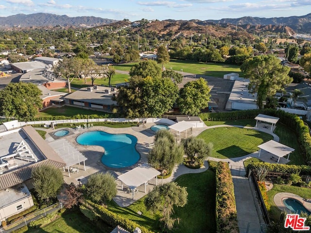 birds eye view of property featuring a mountain view