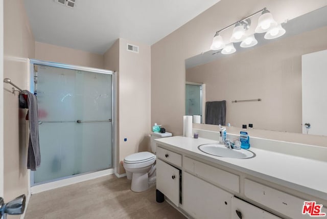 bathroom with toilet, a shower with door, wood-type flooring, and vanity