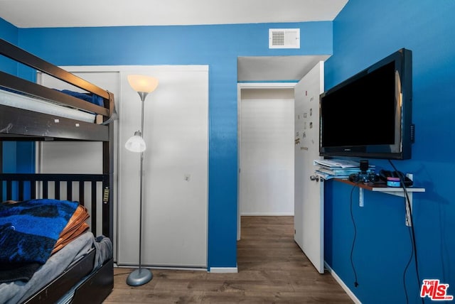 bedroom featuring hardwood / wood-style flooring