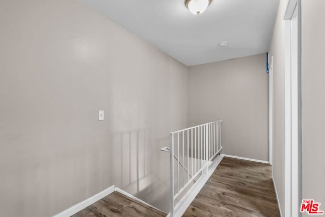 stairs with hardwood / wood-style flooring