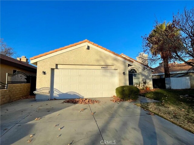 single story home with a garage