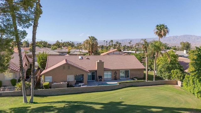 back of house with a mountain view