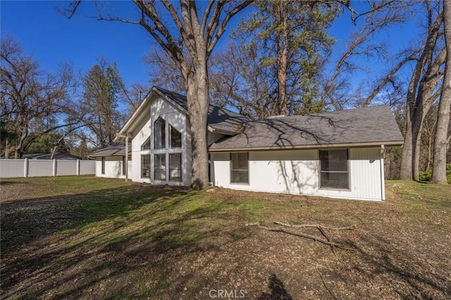 back of house with a yard