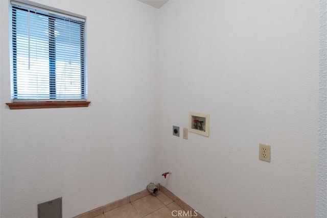 washroom with washer hookup, light tile patterned floors, hookup for a gas dryer, and electric dryer hookup