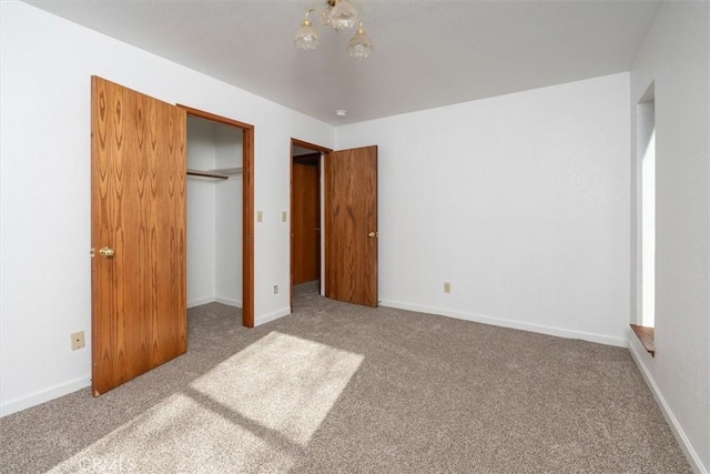 unfurnished bedroom featuring a closet and carpet flooring