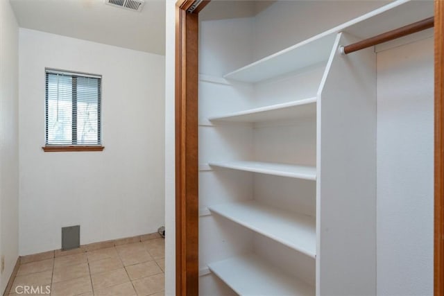 walk in closet featuring light tile patterned floors