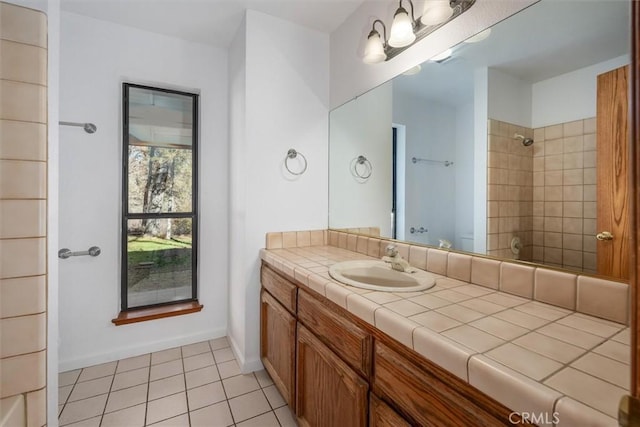 bathroom featuring toilet, tile patterned flooring, and vanity