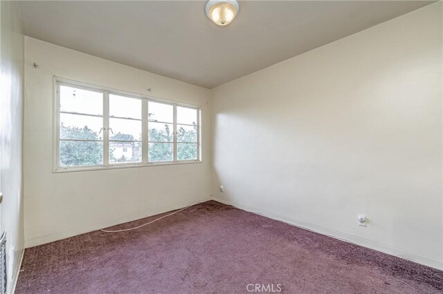 unfurnished room with carpet floors