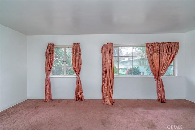 empty room with light colored carpet