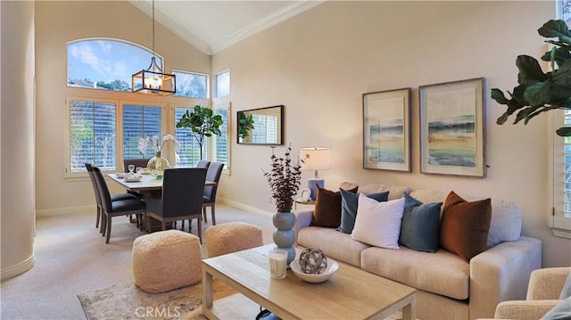 carpeted living room featuring crown molding, a high ceiling, and a notable chandelier