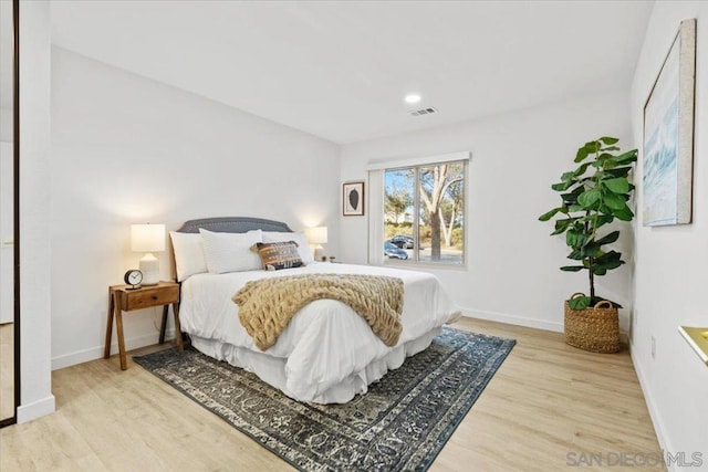 bedroom with light wood-type flooring