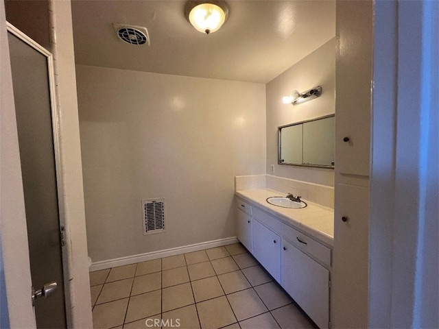 bathroom featuring tile patterned floors and vanity