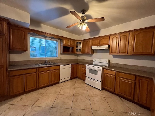 kitchen featuring ceiling fan, light tile patterned floors, sink, and white appliances