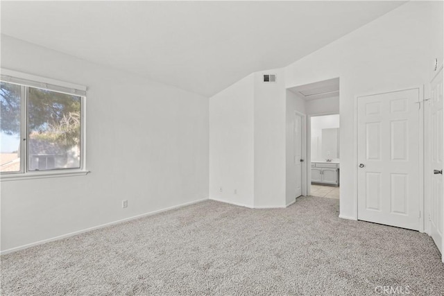 unfurnished room with light colored carpet