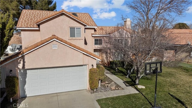 view of front of property featuring a garage and a front yard