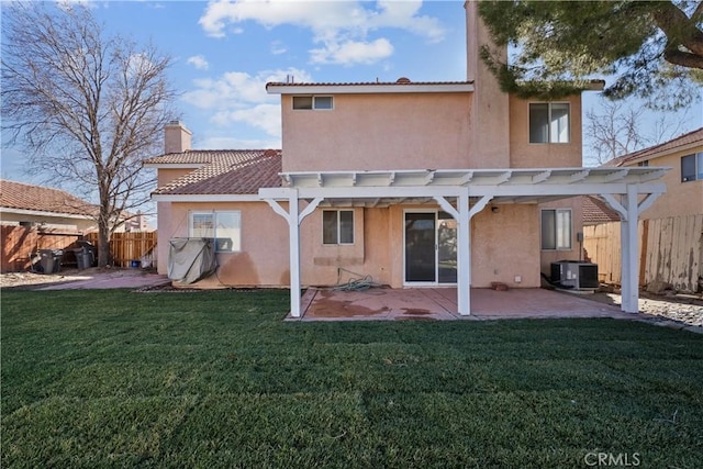 rear view of house with a yard, a patio, and a pergola