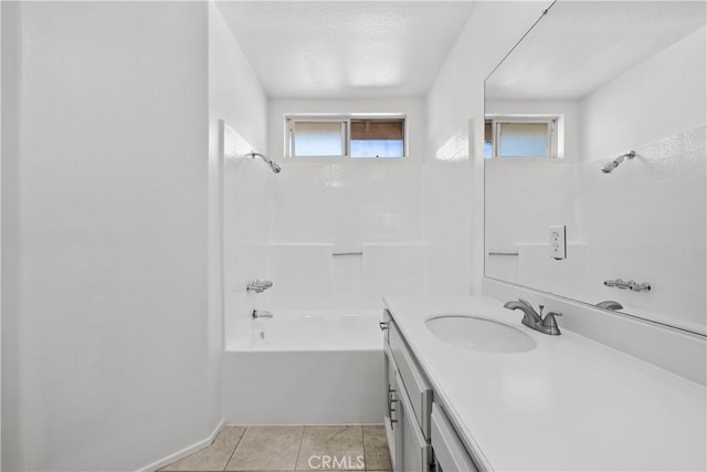 bathroom with washtub / shower combination, tile patterned floors, and vanity