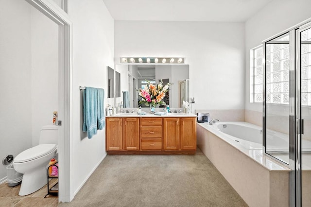 full bathroom featuring separate shower and tub, vanity, and toilet