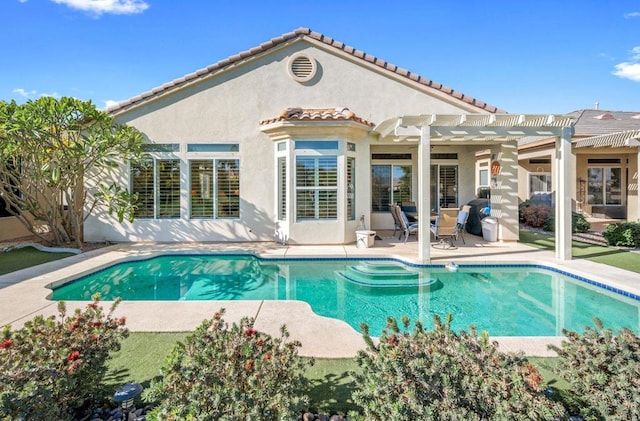 view of pool with a pergola and a patio area