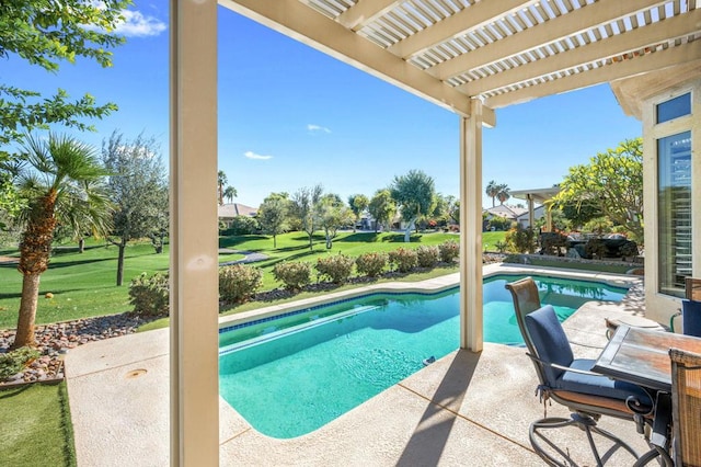 view of pool featuring a patio area, a yard, and a pergola