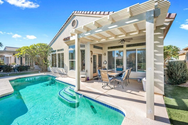 view of pool with ceiling fan, a pergola, and a patio area