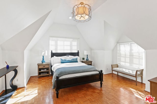 bedroom with parquet floors and vaulted ceiling