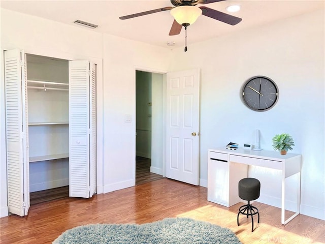 bedroom with ceiling fan and light hardwood / wood-style flooring