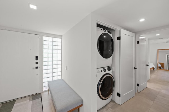 laundry room with stacked washer and clothes dryer