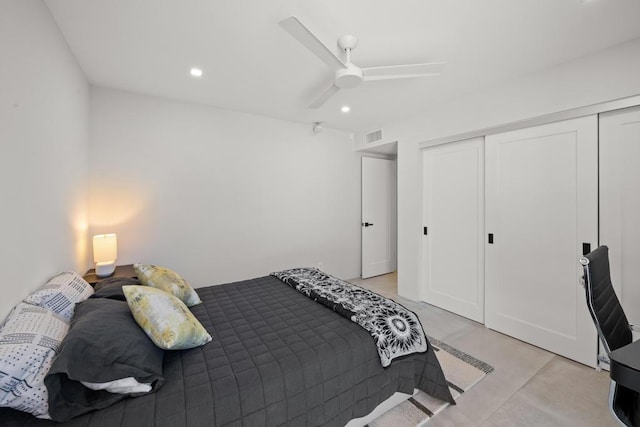 bedroom with ceiling fan and a closet