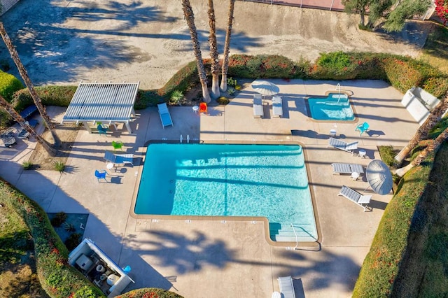 view of swimming pool with a patio area