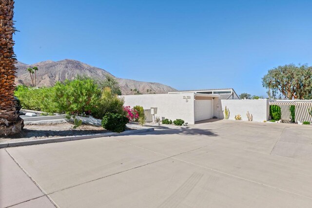 exterior space featuring a mountain view and a garage