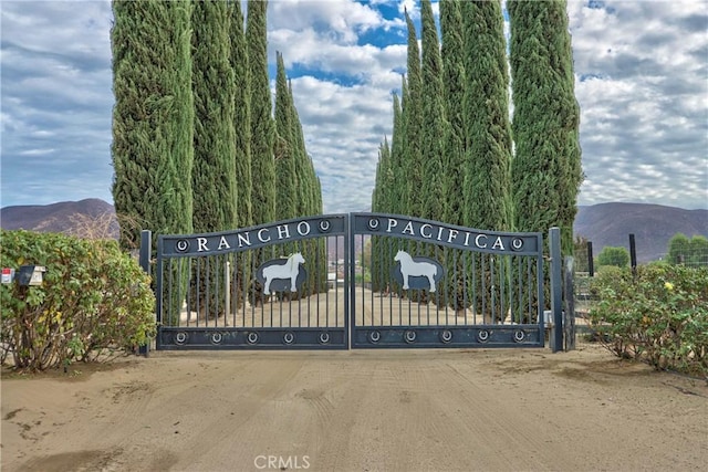 view of gate with a mountain view