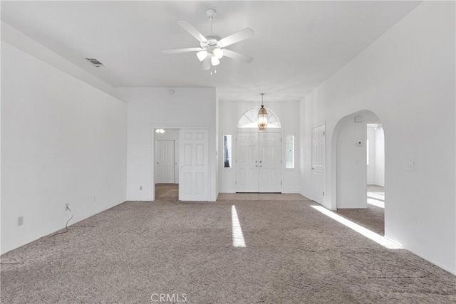 interior space featuring ceiling fan and carpet flooring