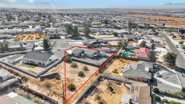 birds eye view of property featuring a mountain view