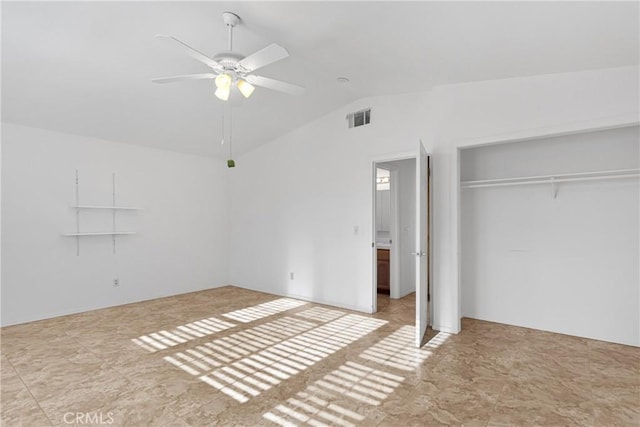 unfurnished bedroom with ceiling fan, a closet, and lofted ceiling