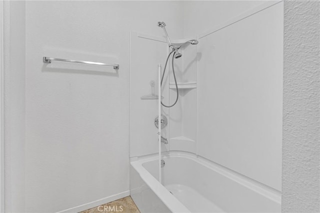 bathroom with washtub / shower combination