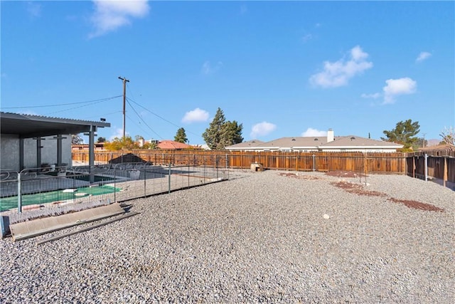 view of yard with a patio area and a swimming pool