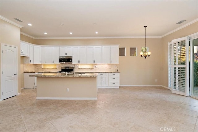 kitchen featuring a center island with sink, white cabinets, visible vents, and appliances with stainless steel finishes